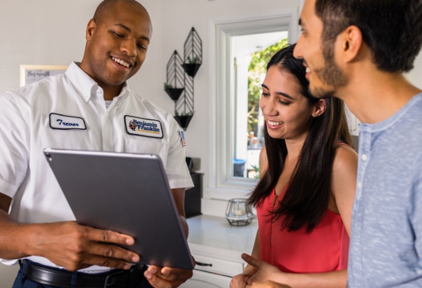 Benjamin Franklin explaining to homeowners how much house repiping will cost