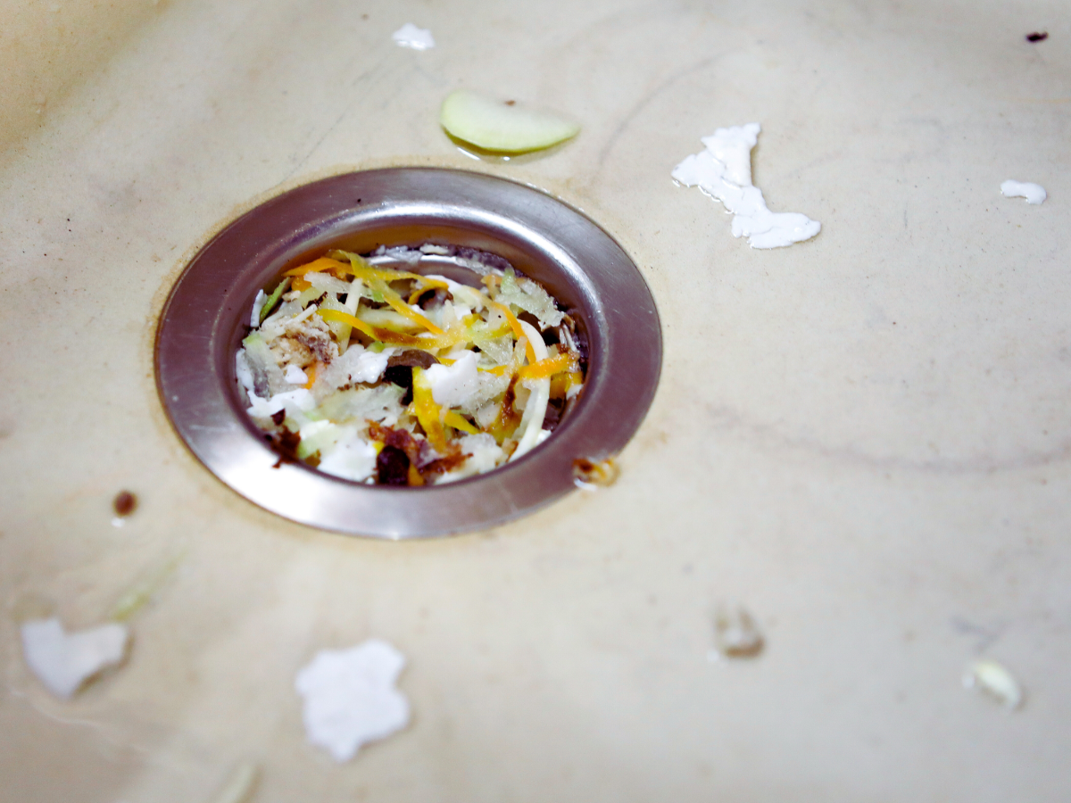 close up of clogged garbage disposal