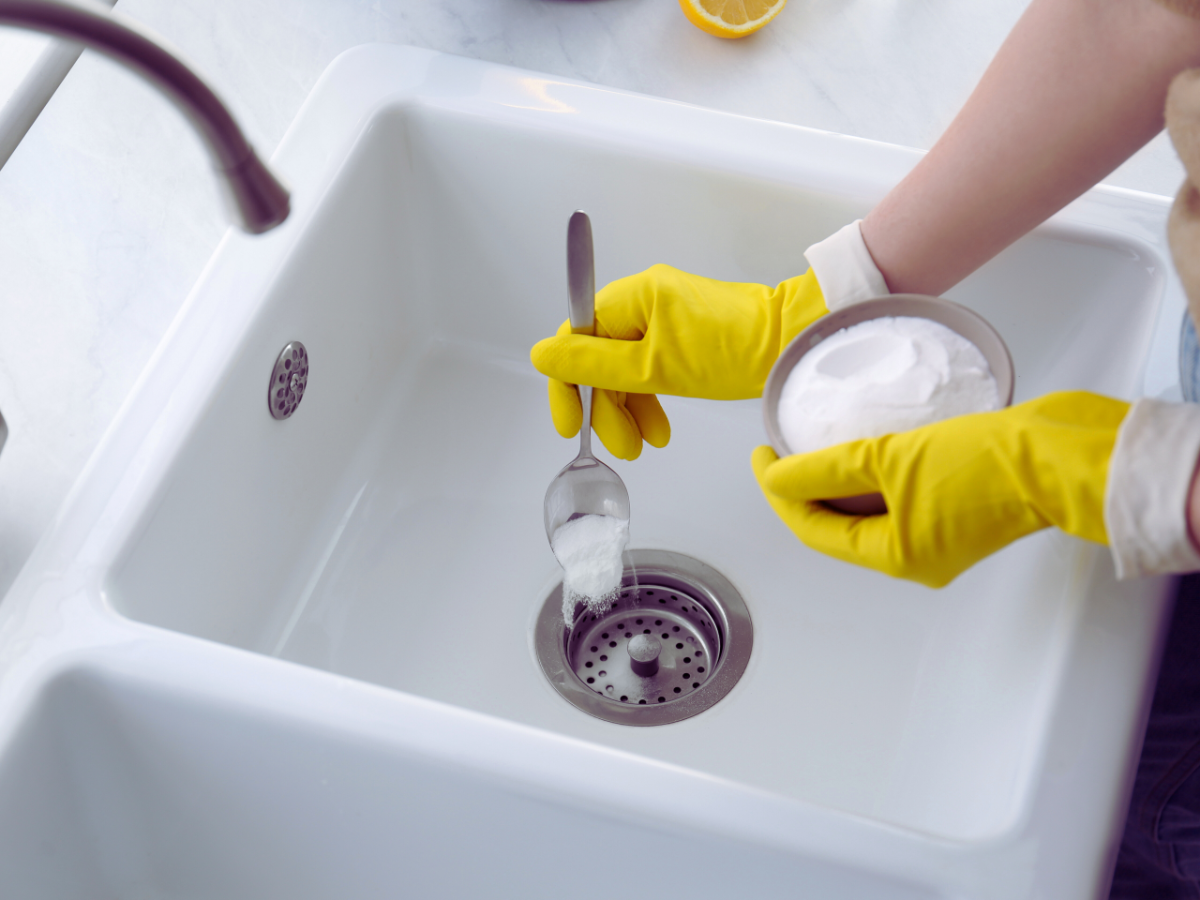 homeowner cleaning garbage disposal with baking soda is something you can do for maintenance