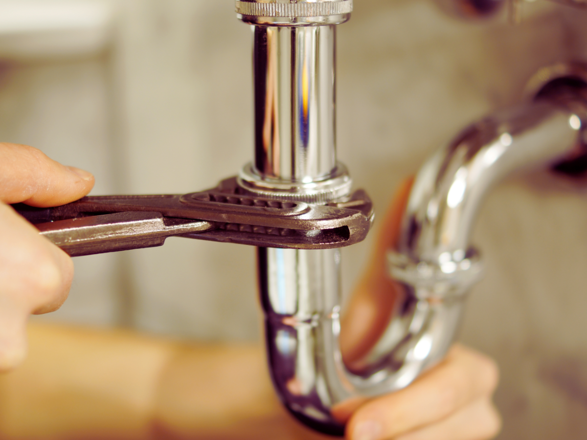 Homeowner installing faucet himself