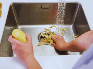 potatoes peels being stuffed into garbage disposal are example of what can't go in it